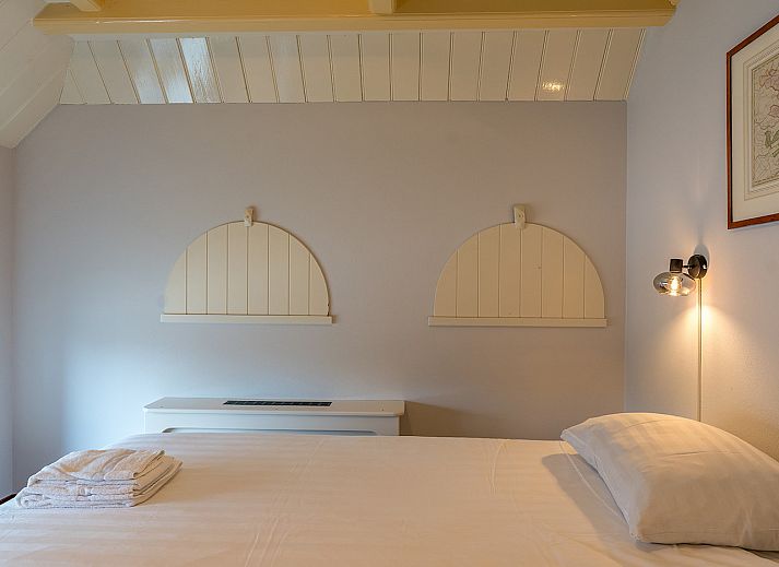 Cozy living room of Zilverling vacation home in Oosterend, Texel overlooking the terrace.