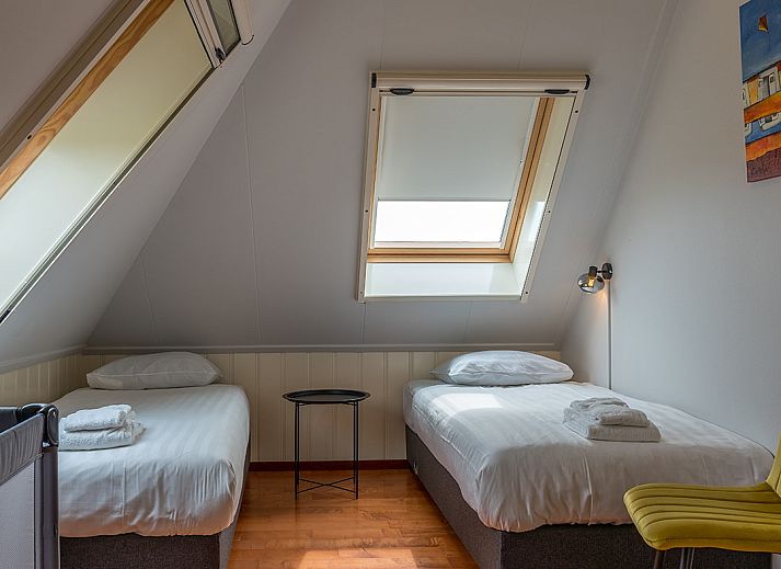 Comfortable sitting area with fireplace in Zilverling vacation home, Oosterend, Texel.