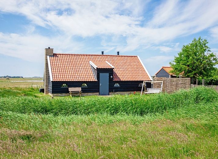 ZoWad - Molenhuisje Beaufort, vakantiehuis in Oosterend Texel met charmant exterieur en groene omgeving.
