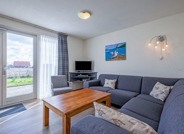 Type II - nr. 43 Stormvogel vakantiehuis met terras in Oosterend, Texel omgeven door groene natuur.