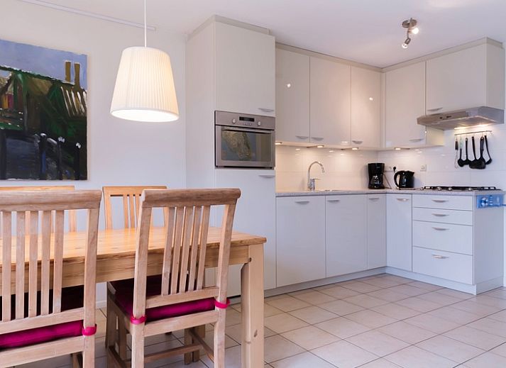 Type I - No. 49 Kragenmaker in Oosterend Texel, charming vacation home with red facade and green garden on the Wadden Islands.