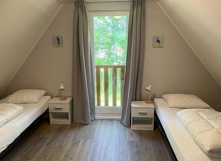 Cozy terrace at Type I - No. 89 Lark, vacation home in Oosterend, Texel, overlooking lush gardens.