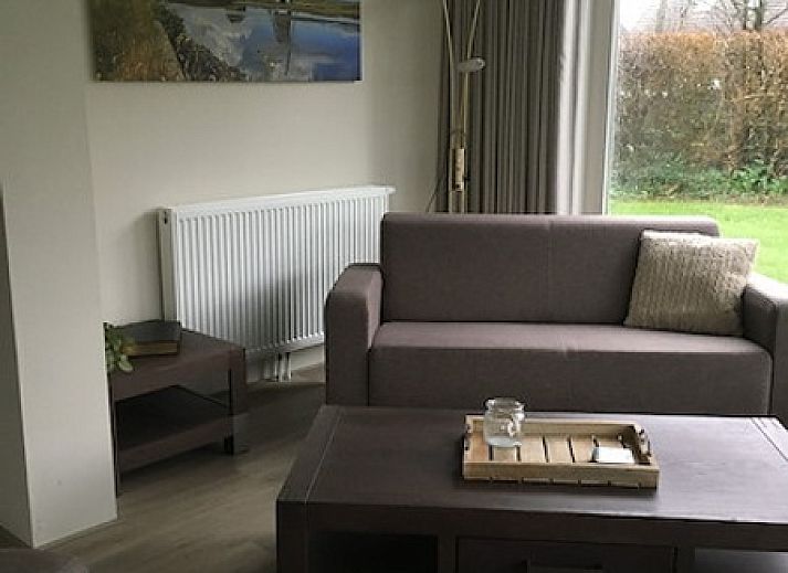 Leuchtturm-Ferienhaus in Oosterend, Texel mit grosser Veranda und gruener Umgebung.