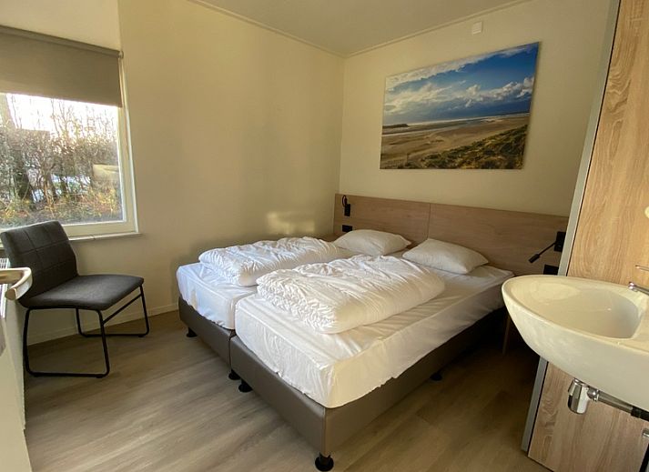 Leuchtturm-Ferienhaus in Oosterend, Texel mit grosser Veranda und gruener Umgebung.