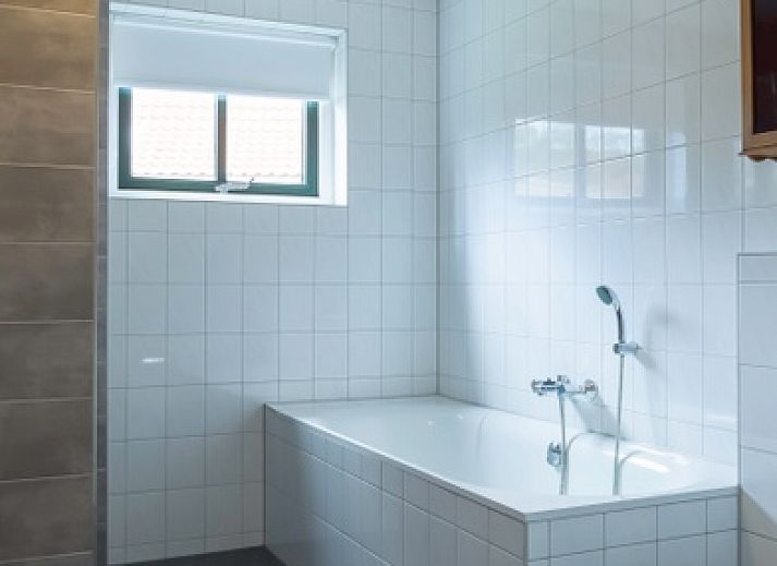 Veranda von Typ III - Nr. 21B Fasan, Ferienhaus auf Texel, mit gemuetlicher Sitzecke und Gartenblick.