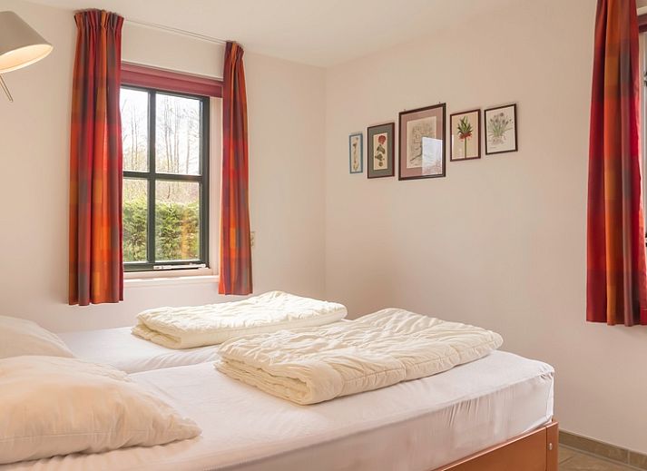 Veranda von Typ III - Nr. 21B Fasan, Ferienhaus auf Texel, mit gemuetlicher Sitzecke und Gartenblick.