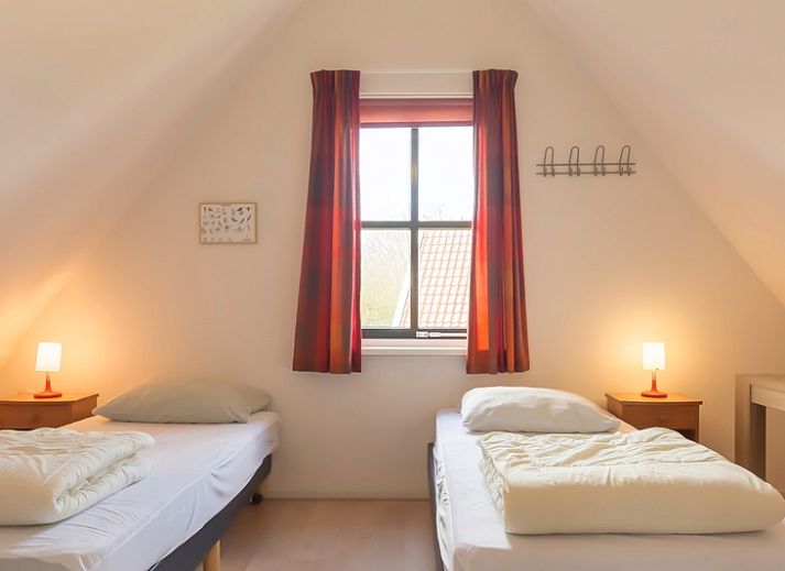 Veranda von Typ III - Nr. 21B Fasan, Ferienhaus auf Texel, mit gemuetlicher Sitzecke und Gartenblick.