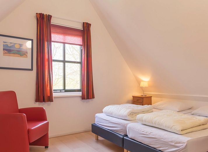 Veranda von Typ III - Nr. 21B Fasan, Ferienhaus auf Texel, mit gemuetlicher Sitzecke und Gartenblick.