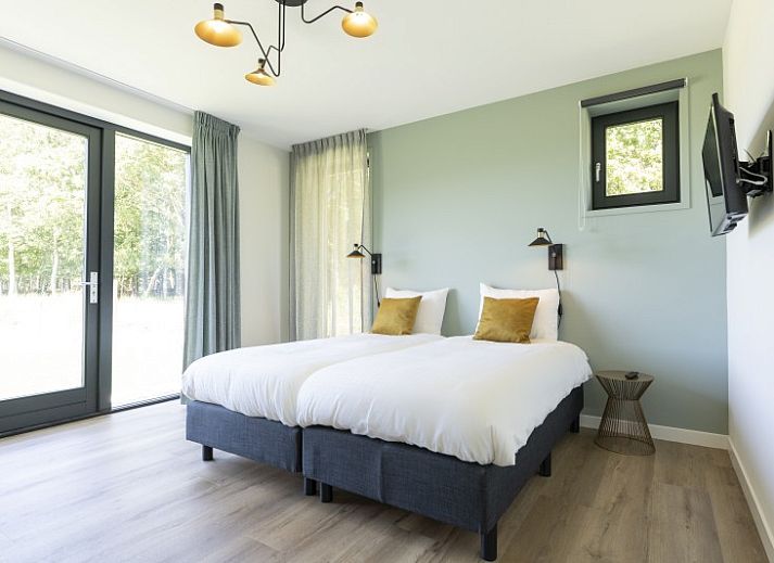 Gemuetliches Wohnzimmer in Rovershut - Family House 1, ein Ferienhaus in Dennenbos, Texel, mit Blick auf die Natur der Watteninseln.