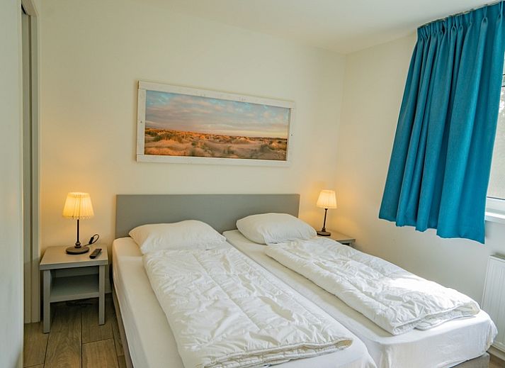 Gemuetliches Wohnzimmer des Ferienhauses de Parel 150 in De Dennen, Texel mit komfortabler Sitzecke.