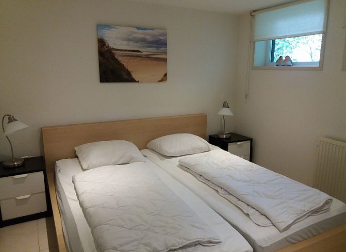 Gemuetliches Wohnzimmer in 't Bollenveld - Iris, Ferienhaus in De Dennen, Texel, mit komfortabler Sitzecke und moderner Einrichtung.