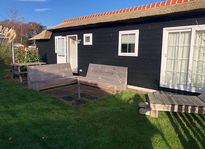 Vacation park de Bremakker - Akkerveld 15, Texel: charming vacation home with wooden veranda in De Dennen, Wadden Islands.