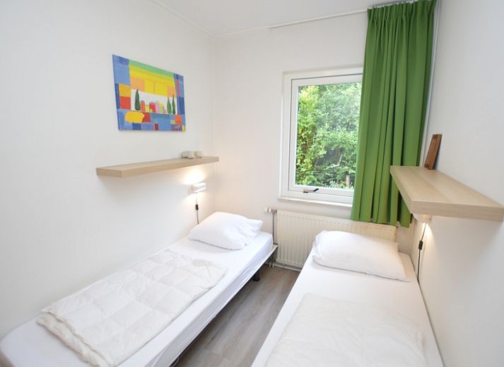Gezellige woonkamer met open haard in Tempelierweg 24, De Dennen, Texel vakantiehuis.