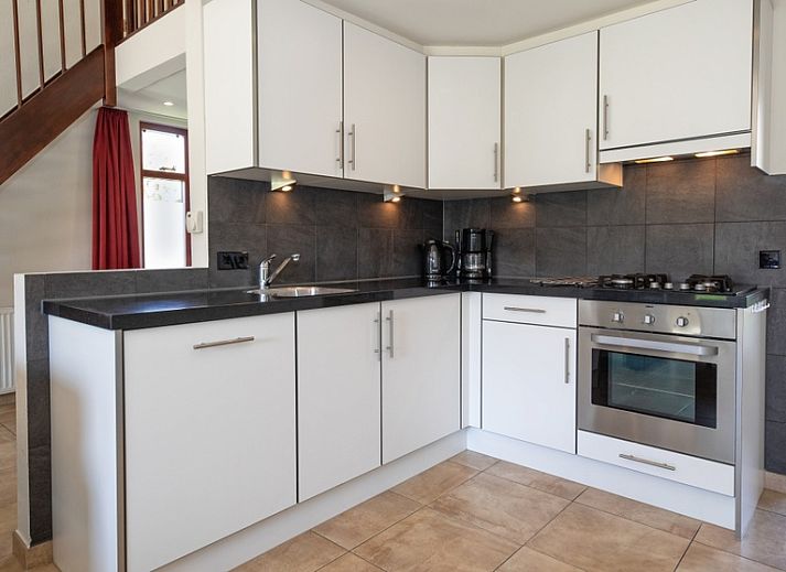 Sunny terrace at Holiday home Gortersmient 270, De Dennen, Texel, ideal for relaxation.