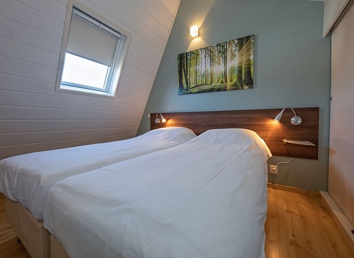 Sunny terrace at Holiday home Gortersmient 270, De Dennen, Texel, ideal for relaxation.