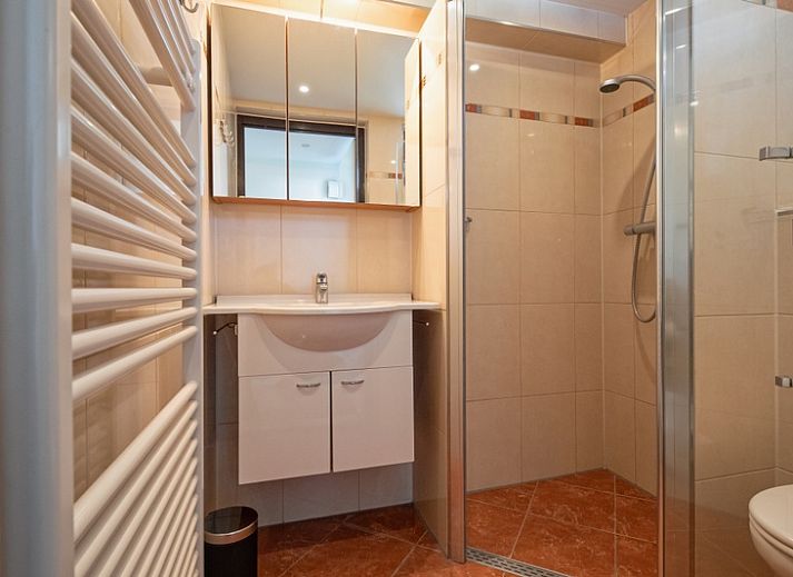 Comfortable living room in Holiday home Gortersmient 270, De Dennen, Texel overlooking the garden.