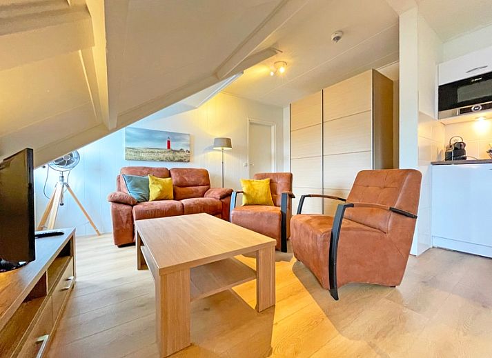 Cozy living room in Apartment Bos en Duin 34, De Dennen, Texel with comfortable seating area.
