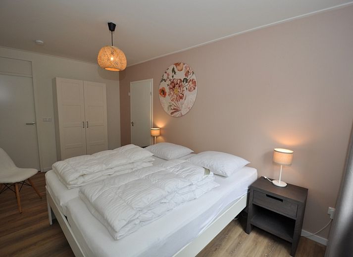 Charmant vakantiehuis Bungalow Verste Coogh 62 in De Dennen, Texel met gezellige buitenruimte, ideaal voor natuurliefhebbers.