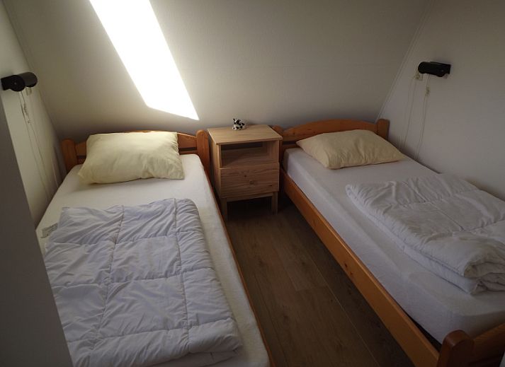 Gezellige binnenruimte met eethoek in Vakantiehuis Gortersmient 210, De Dennen, Texel.