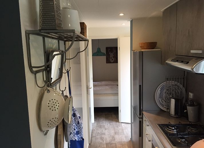 Relax on the terrace of Holiday Park de Bremakker - Chalet on Texel, Weideveld 80, surrounded by nature in De Dennen, Wadden Islands.