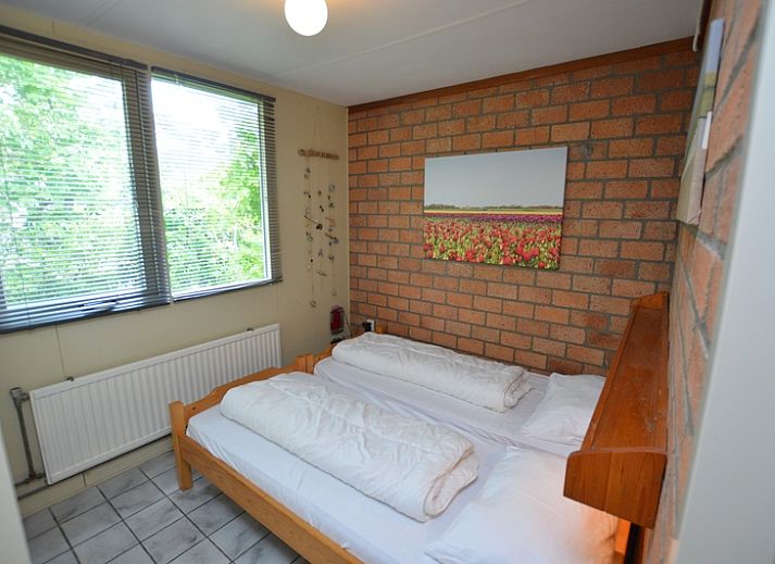 Stijlvolle zithoek in Bungalow Verste Coogh 56 in De Dennen, Texel, perfect voor ontspanning op de Waddeneilanden.