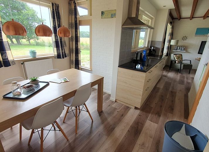 Weizicht Texel vakantiehuis in De Dennen, Texel, met terras en omringd door natuur op de Waddeneilanden.