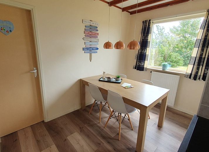 Weizicht Texel vakantiehuis in De Dennen, Texel, met terras en omringd door natuur op de Waddeneilanden.