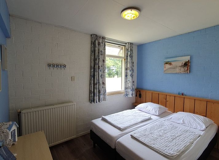 Weizicht Texel vakantiehuis in De Dennen, Texel, met terras en omringd door natuur op de Waddeneilanden.