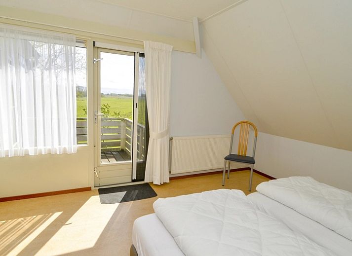 Charmantes Ferienhaus Roodborstje in De Dennen, Texel mit sonniger Veranda.