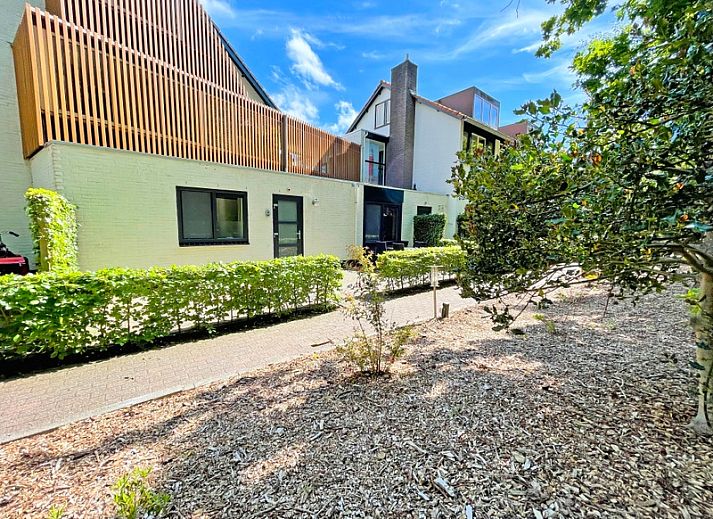 Gezellige zithoek in Appartement Bos en Duin 09, De Dennen, Texel, perfect voor ontspanning na een dagje Waddeneilanden.