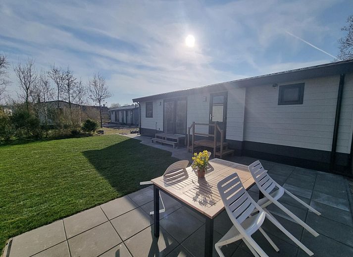 Stylish indoor area of Holiday home the Bremakker in De Dennen, Texel with dining area and views of nature.