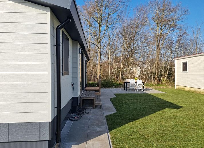 Stylish indoor area of Holiday home the Bremakker in De Dennen, Texel with dining area and views of nature.