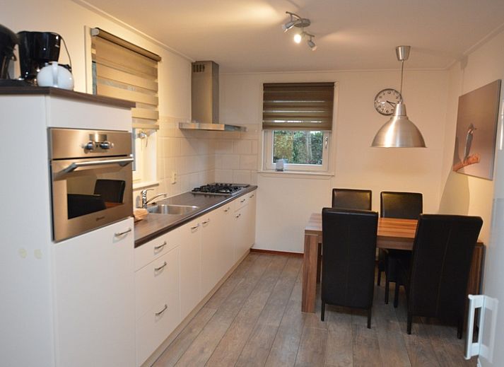 Spacious living room of Holiday home de Parel 214 in De Dennen, Texel, with comfortable seating area.