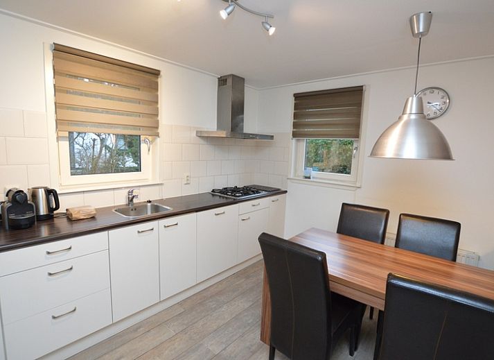 Spacious living room of Holiday home de Parel 214 in De Dennen, Texel, with comfortable seating area.