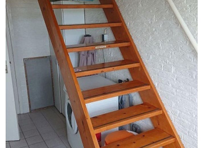 Gemuetliches Wohnzimmer des Ferienhauses Hans in De Dennen, Texel mit Sitzecke.