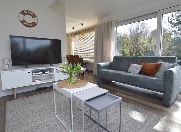 Bungalow Verste Coogh 58 in De Dennen, Texel met zonnige tuin en terras voor ontspanning.