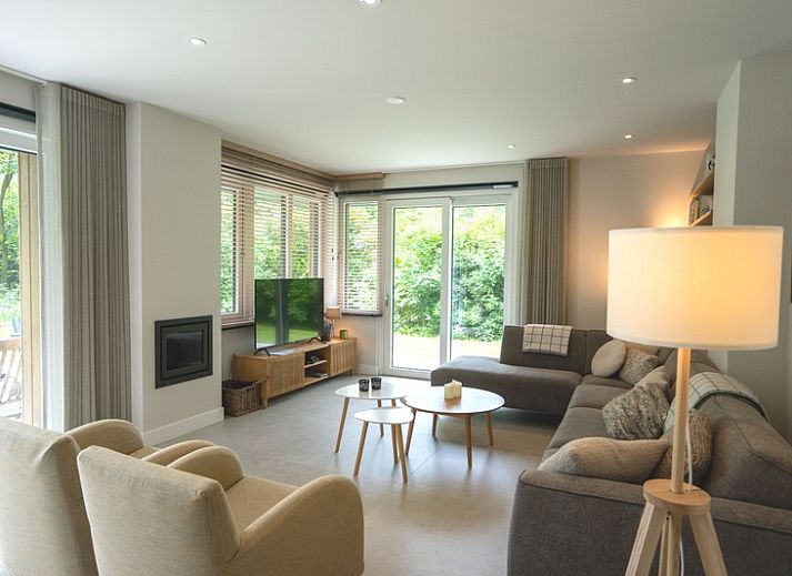 Vakantiehuis de Parel 180 in De Dennen, Texel omgeven door groen en een ruime tuin.