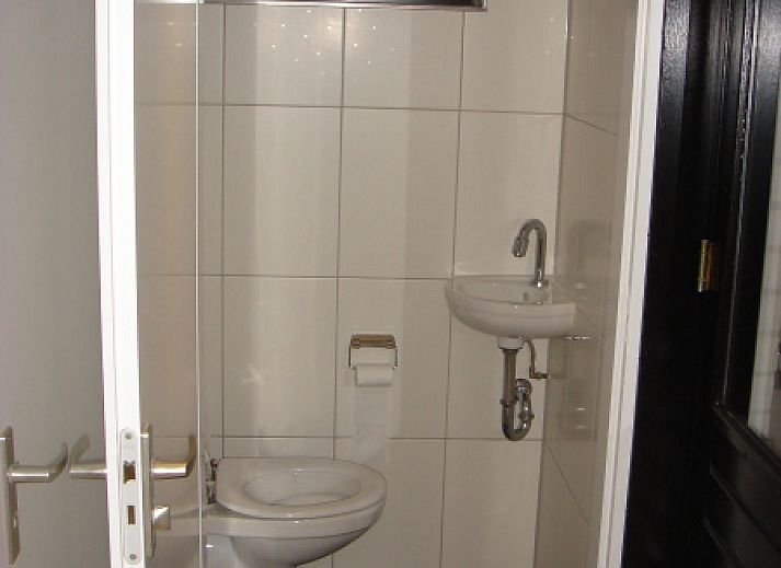 Rustige omgeving van Vakantiehuis Gortersmient 354 in De Dennen, Texel met omringende natuur.