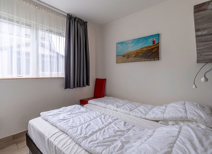 Gezellige woonkamer in Bungalowpark 't Luwe Land, Texelfan, De Dennen, Texel. Comfortabele zithoek met moderne inrichting in de vakantiewoning.