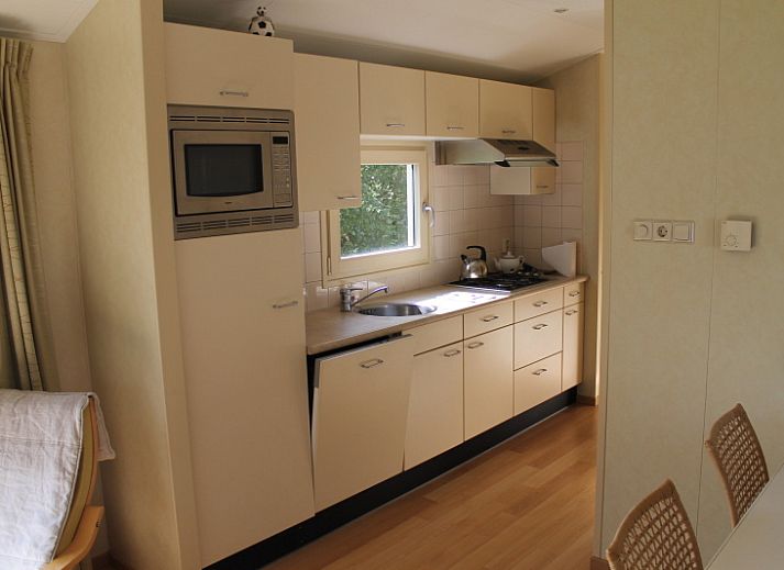 Vakantiepark de Bremakker's vakantiehuis Heitje 166 in De Dennen, Texel, met terras en omringd door natuur op de Waddeneilanden.