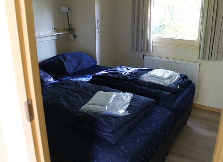 Vakantiepark de Bremakker - Heitje 166, charmant vakantiehuis in De Dennen, Texel, met zonnig terras en groene omgeving op de Waddeneilanden.