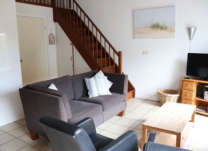 Cozy living room of Holiday home Gortersmient 290 in De Dennen, Texel.