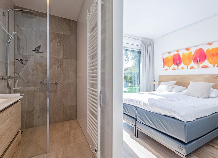 Vakantiehuis Villa Effe Wad in De Dennen, Texel, met grote veranda en uitnodigende buitenruimte.