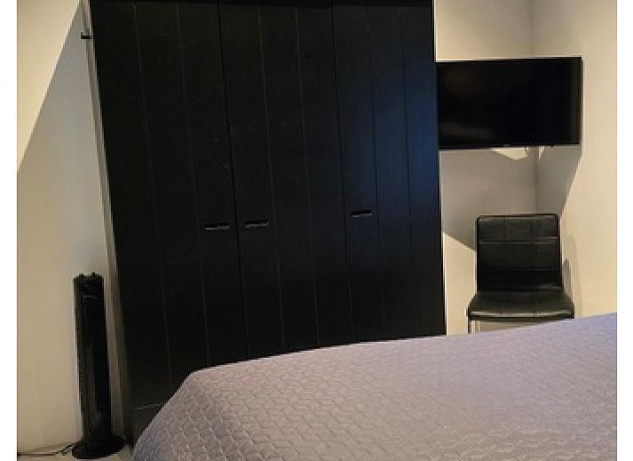 Helianthus Unterkunft in De Dennen Texel mit Blick auf Pferdeweiden fuer eine laendliche Erfahrung.