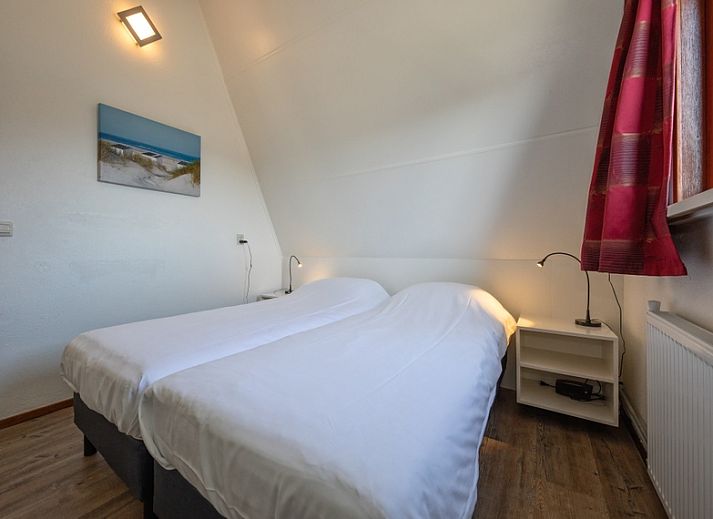 Vakantiehuis Gortersmient 328 in De Dennen, Texel met ruime buitenruimte en tuinmeubilair.