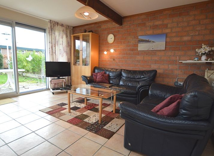 Bungalow Verste Coogh 140 in De Dennen, Texel met groene tuin en zonnige buitenruimte.