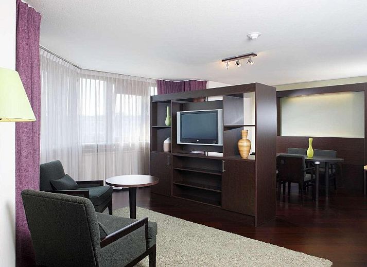 Stylish bedroom with double bed in NH Maastricht vacation apartment, Limburg.