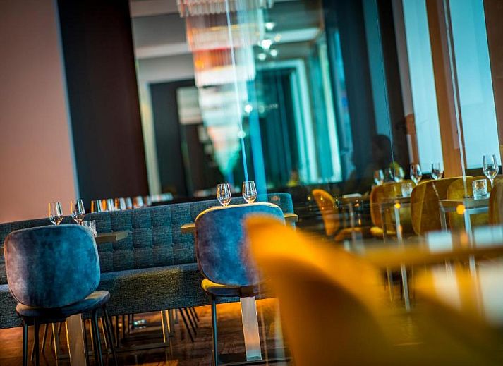 Comfortable bedroom in Derlon Hotel Maastricht, vacation apartment in South Limburg, modern interior and art.