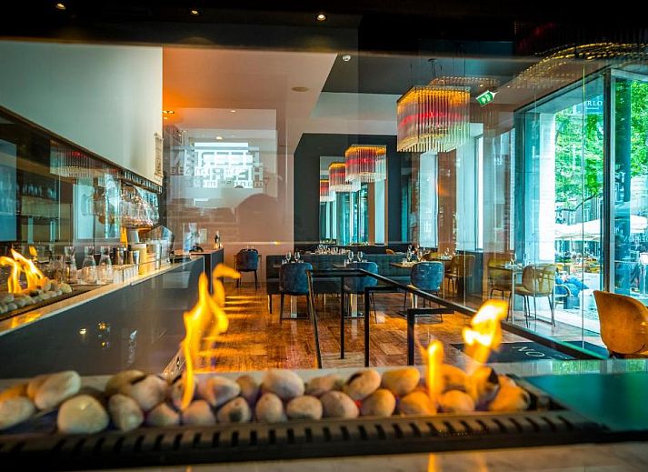 Comfortable bedroom in Derlon Hotel Maastricht, vacation apartment in South Limburg, modern interior and art.