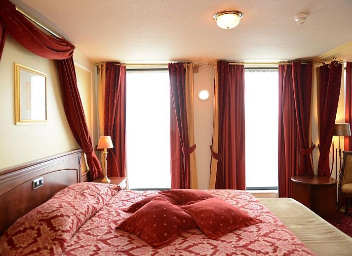 Comfortable room with a view in Amrath Grand Hotel de l'Empereur, Maastricht, perfect for a relaxing vacation.
